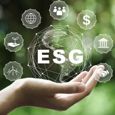 A hand holding a 3D globe with the letters "ESG" surrounded by icons representing environmental, social, and governance elements.